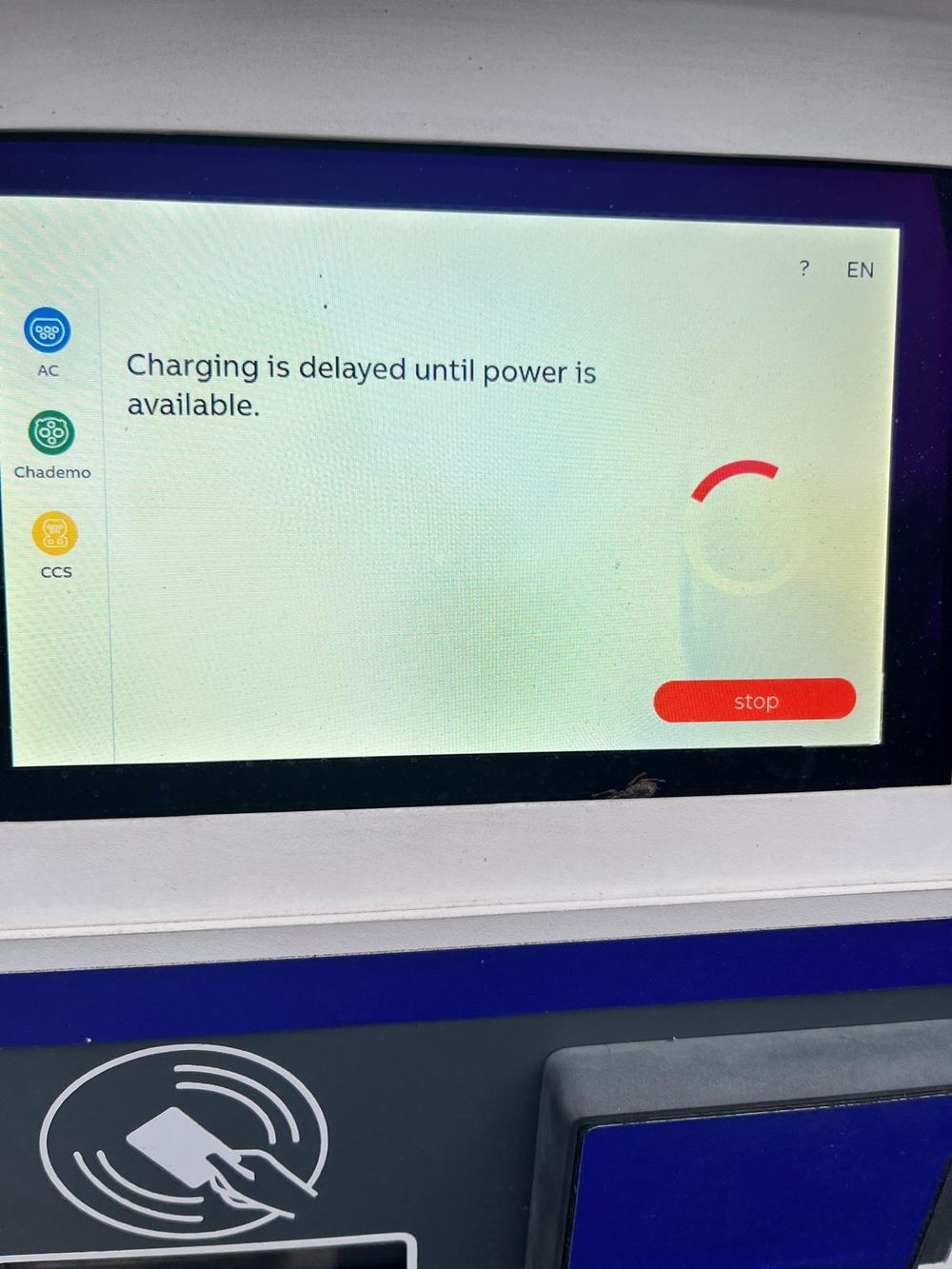 Public fast charger screen displaying the message: Charging is delayed until power is available